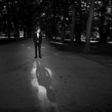 man-suit-standing-park