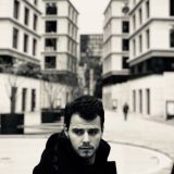 young-man-against-buildings-city